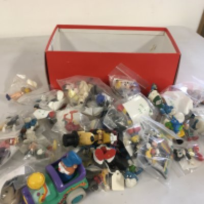A box containing in excess of 35 figures featuring Smurfs..Mickey Mouse..Wallace and Grommit..power rangers etc. no reserve 