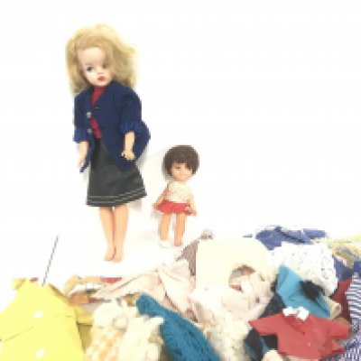 A Vintage Sindy Doll Various Clothes And One Other Doll.