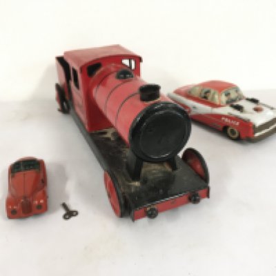 3x tin model vehicles including 1x Schuco Examico 4001 clockwork car with key.  A litho print friction model police car possibly Philipp lowmeier.   Also a locomotive with 4 wheels  unbranded.  No reserve 