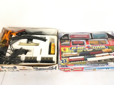 A boxed midnight express train set and one other