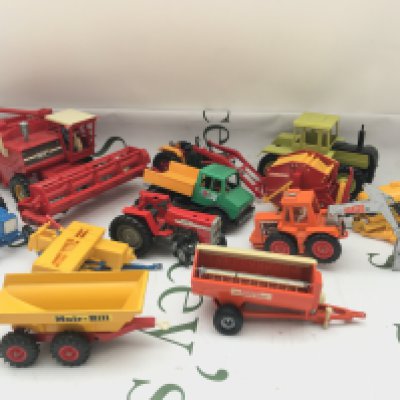 A Collection Of Playworn Farming Machinery And Military Toys.