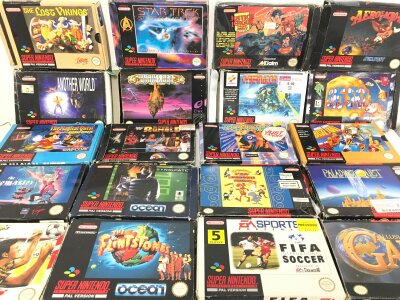 A Collection Of 20 Box Super Nintedo Games. 4 Do Not Have Instructions.