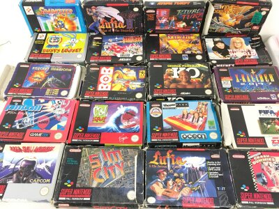 A Collection Of 20 Super Nintendo Games. Sim City. Wing Commander And Fortress Of Doom Have No Instuctions.