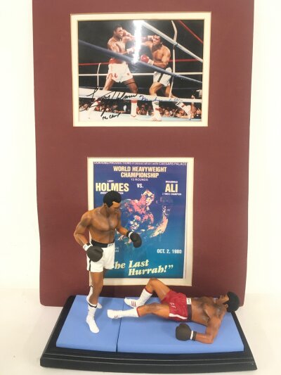 A Endurance Art Of Sport Muhammad Ali Vs George Foreman With A Unframed Signed Picture By Muhammad Ali And Larry Homes.(No Cert)(2).