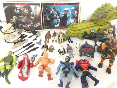 A Collection Of Vintage Star WarsFigures/Puzzles. Master Of The Universe Figures And A Star Wars 1995 Video Shop Sign. (2).