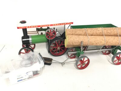 A Mamod Steam Tractor With 2 Trailers and Spares.