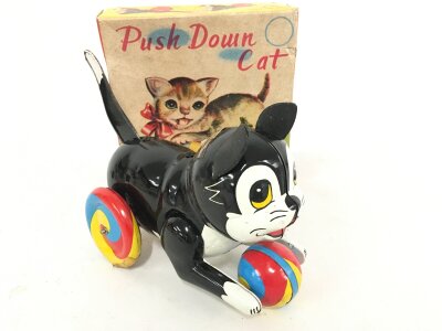 A Boxed Tinplate Japanese Push Down Cat.