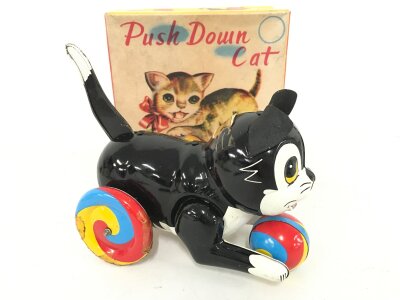 A Boxed Tinplate Japanese Push Down Cat.