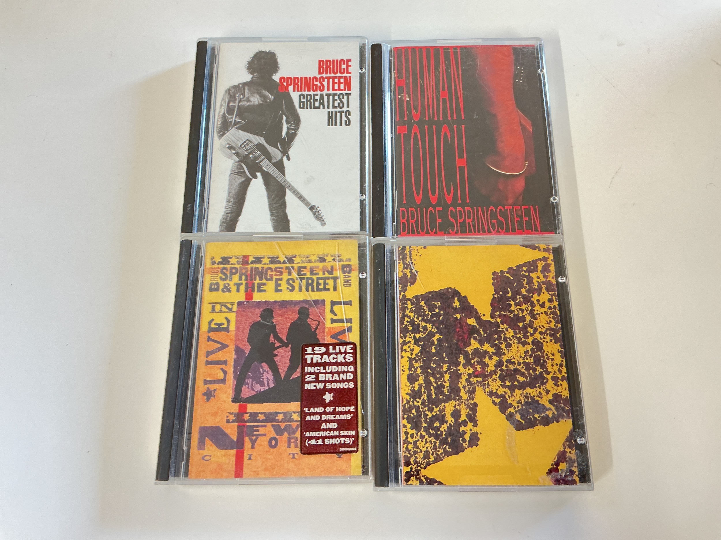 Four Bruce Springsteen minidiscs.