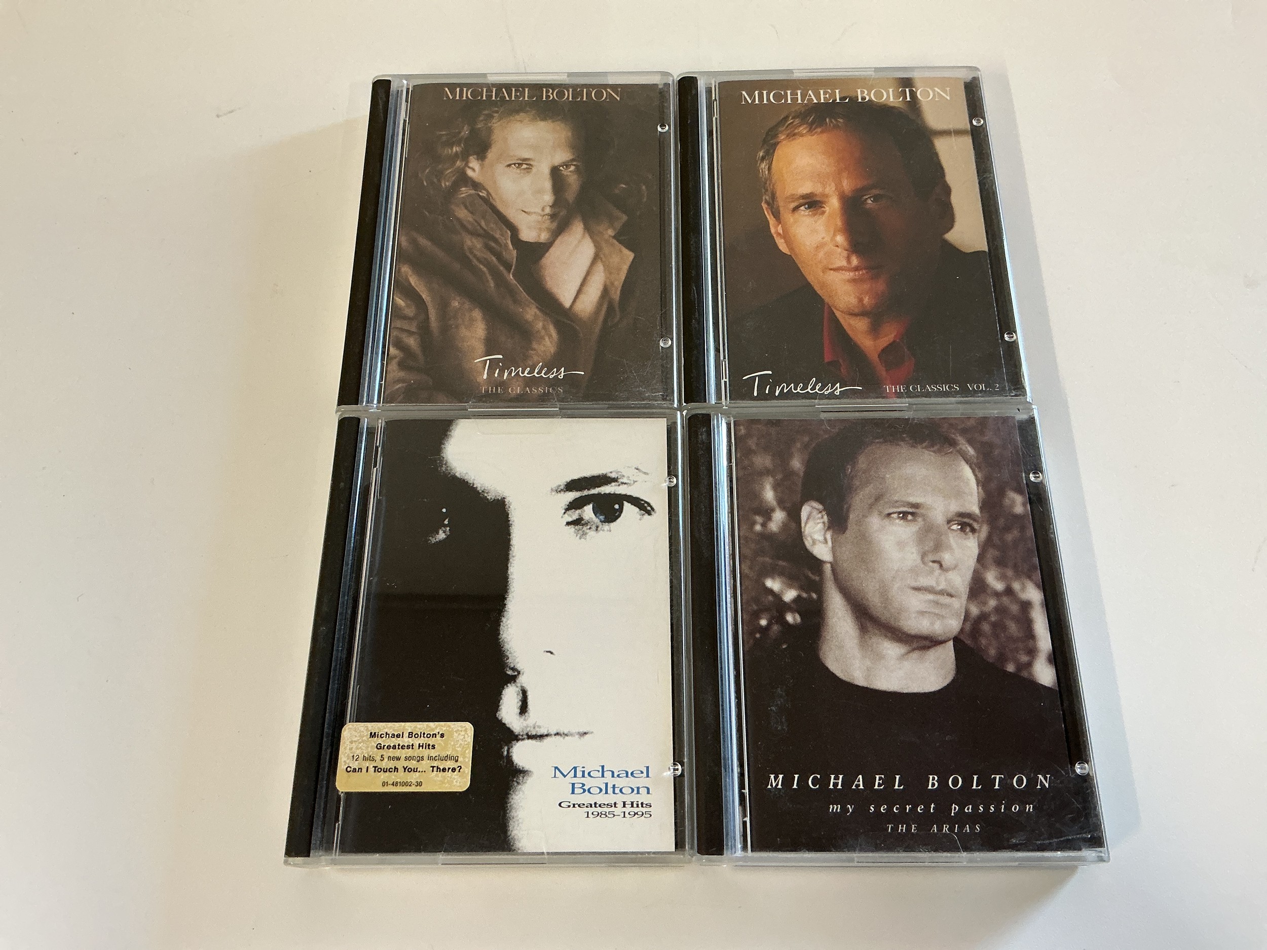 Four Michael Bolton minidiscs.