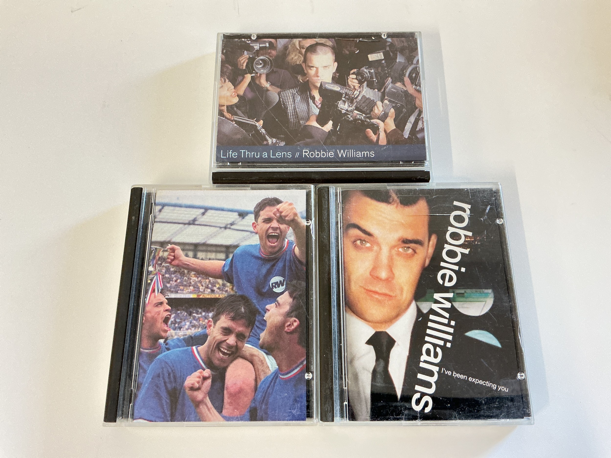Three Robbie Williams minidiscs comprising Sing When You're Winning, Life Thru A Lens and I've Been Expecting You.