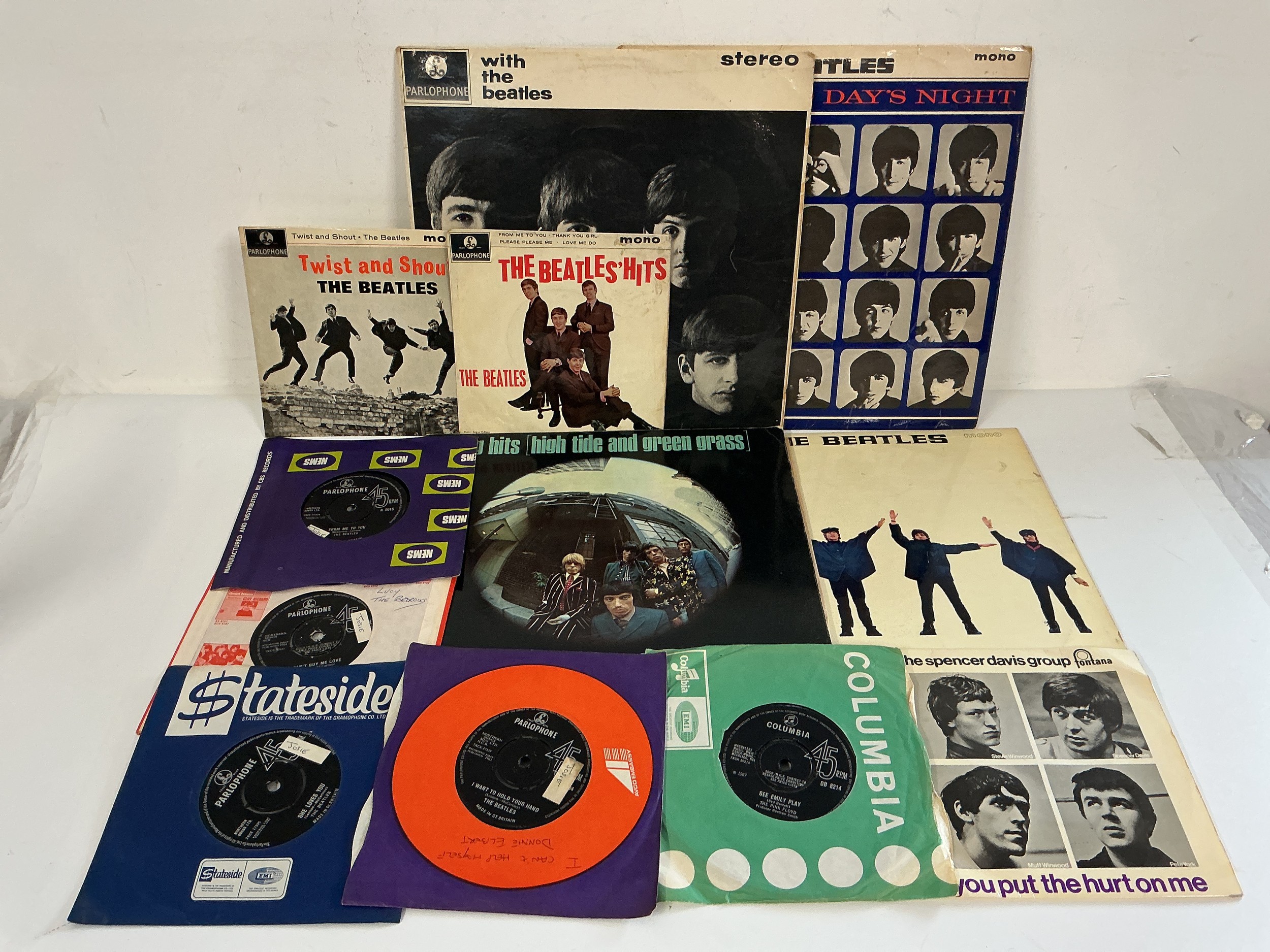 A collection of 1960s 7" singles, EPs and LPs by various artists including Pink Floyd, The Beatles, Spencer Davis Group and The Rolling Stones.