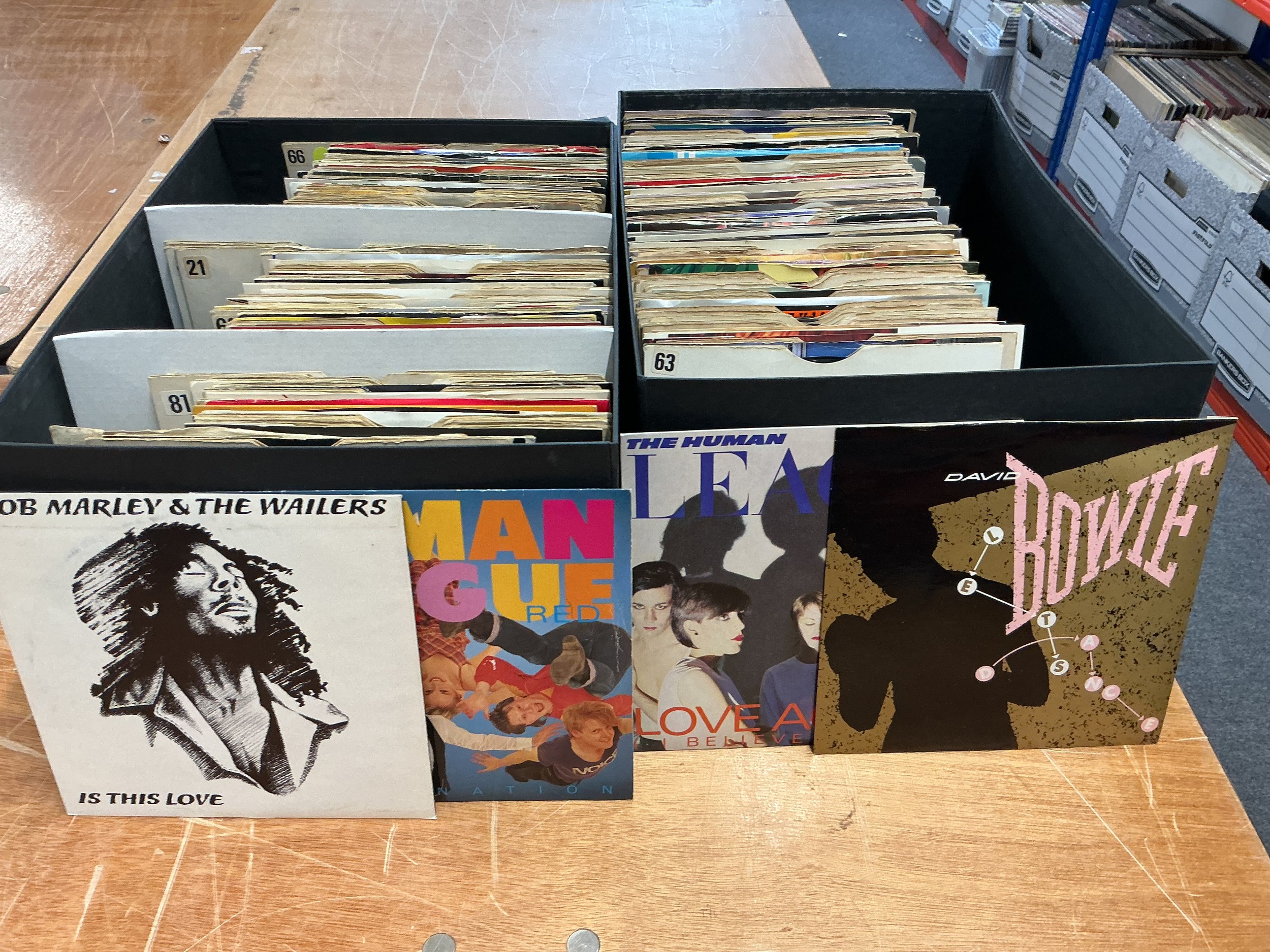 Ten boxes of 7" singles by various artists including The Rolling Stones, Queen, Parliament, Siouxsie & The Banshees and many more.