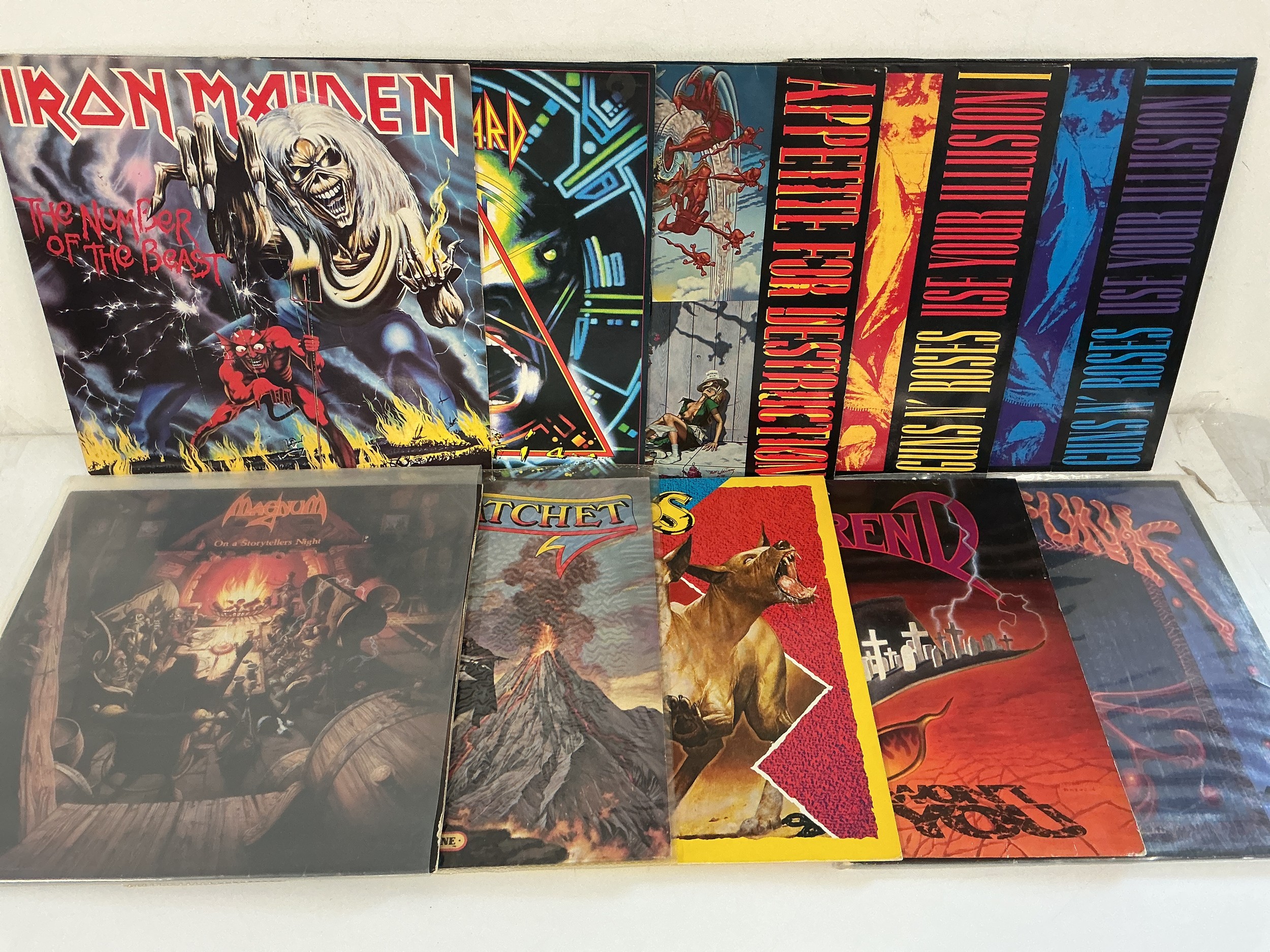 Ten hard rock and metal LPs by various artists including Iron Maiden, Guns n Roses, Def Leppard and others. Includes coloured vinyl.