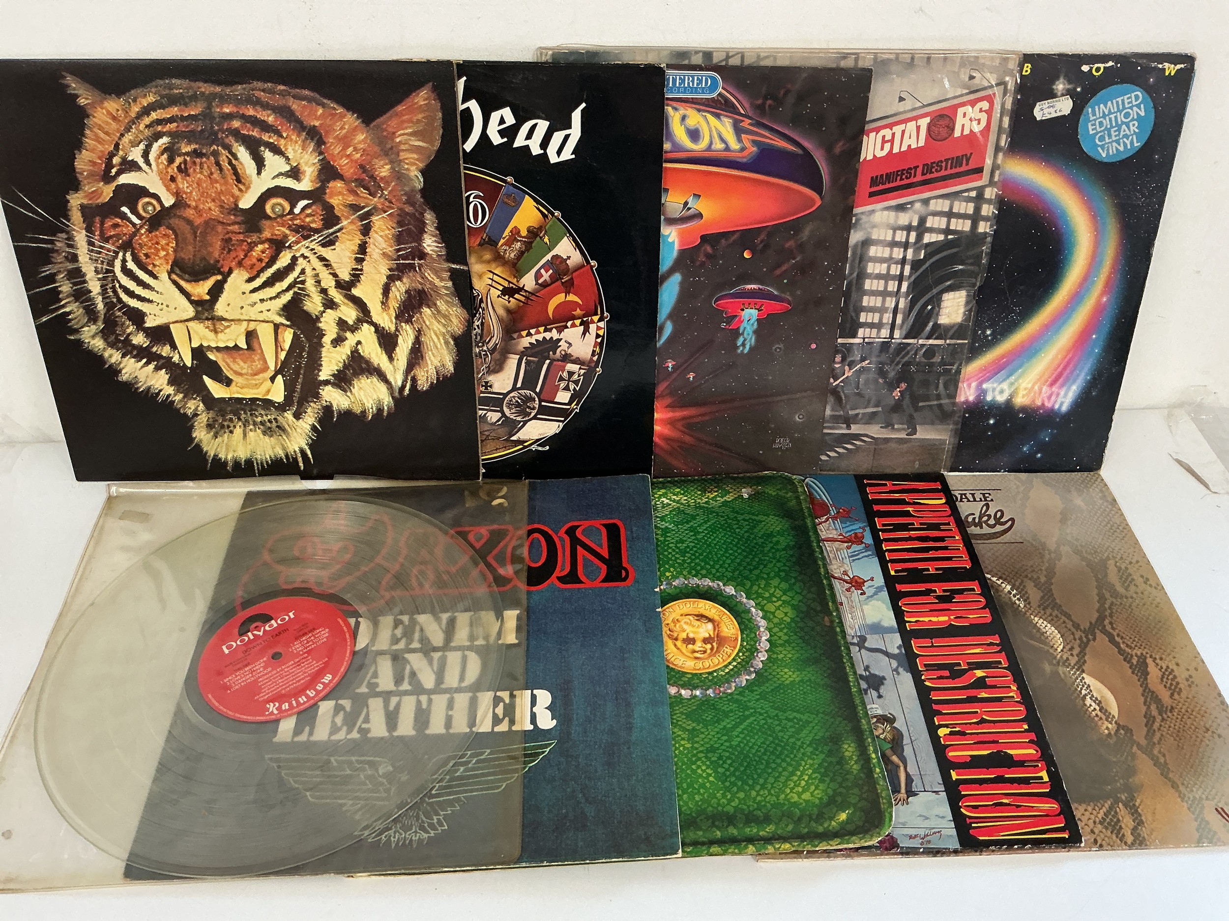 Two bags containing 20 rock LPs by various artists including Alice Cooper, Motörhead, Rainbow, Guns n Roses and others.