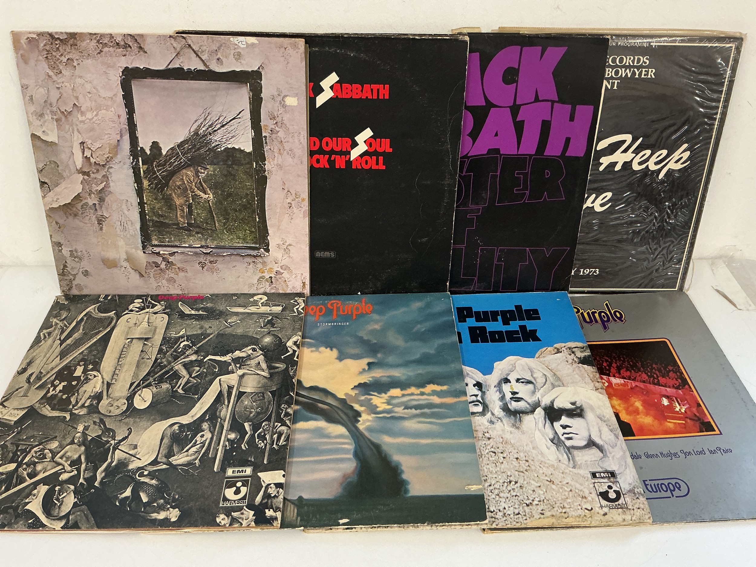Two bags containing 16 rock LPs by various artists including Led Zeppelin, Hawkwind, Black Sabbath, Deep Purple and others.