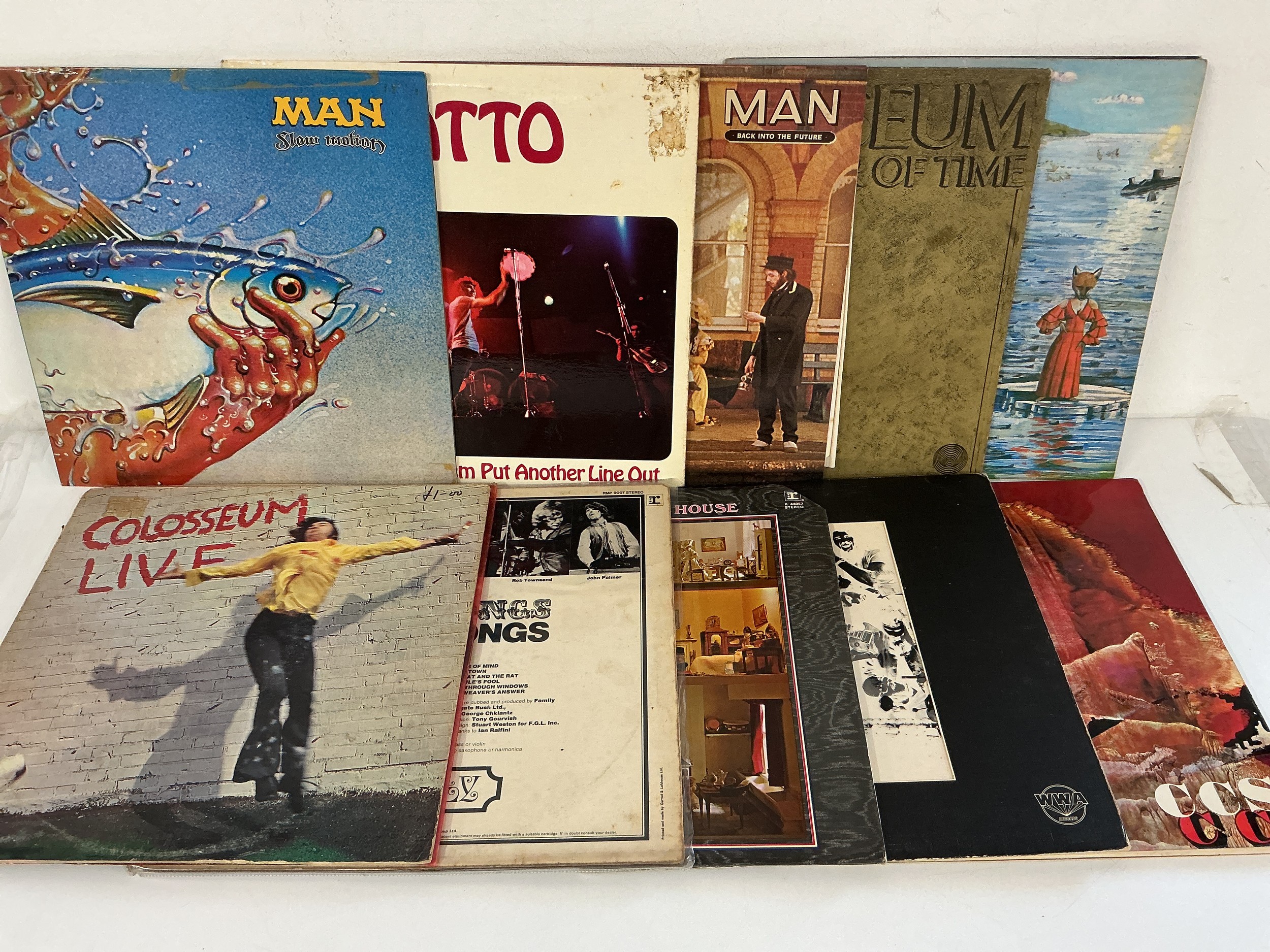 Two bags containing 20 rock and prog rock LPs by various artists including Gentle Giant, Family, Colosseum, Man and others.