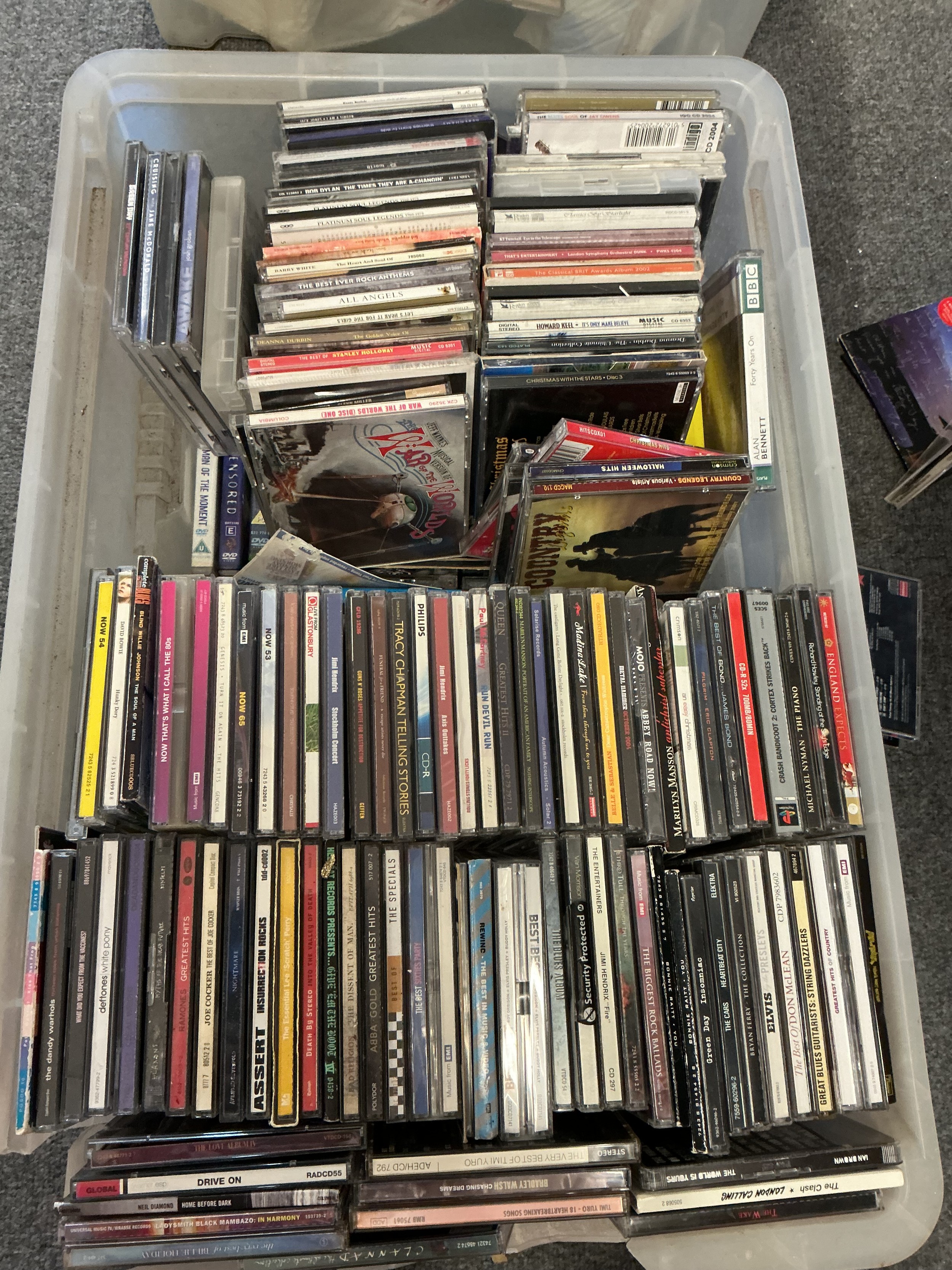 Four boxes of CDs, DVDs and BluRays.
