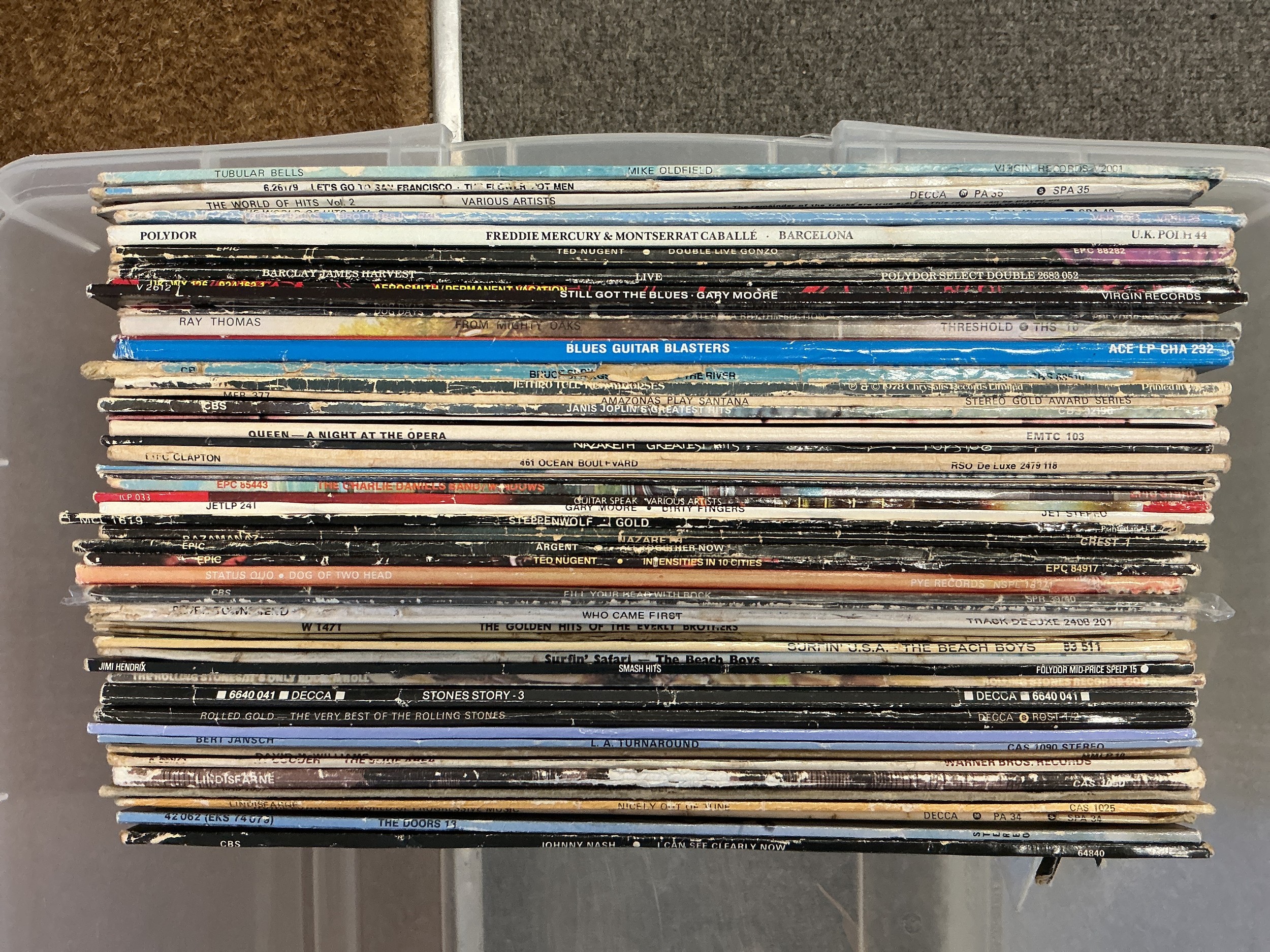 A collection of LPs and 7" singles by various artists including The Rolling Stones, Aerosmith, Queen and others.