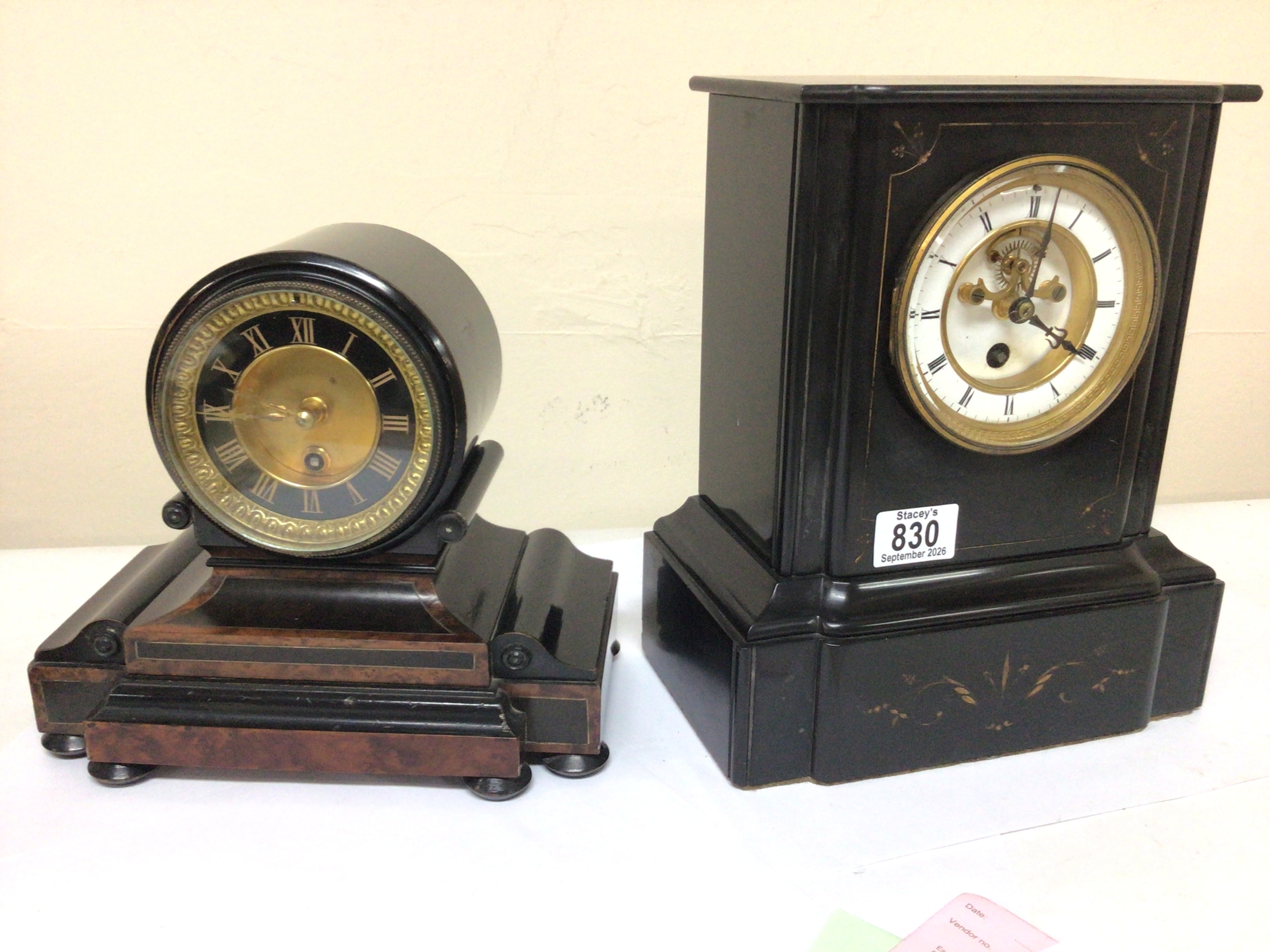  A Victorian black slate mantel clock with a visible escapement French movement with pendulum seen working and one other Victorian walnut and ebony veneered wall clock (2)  