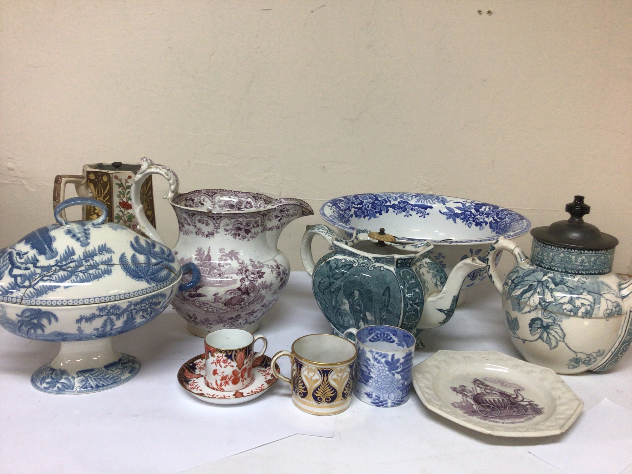  A box containing Victorian ceramic tea pots a 19th century blue and white Spode bowl jugs plates etc. 