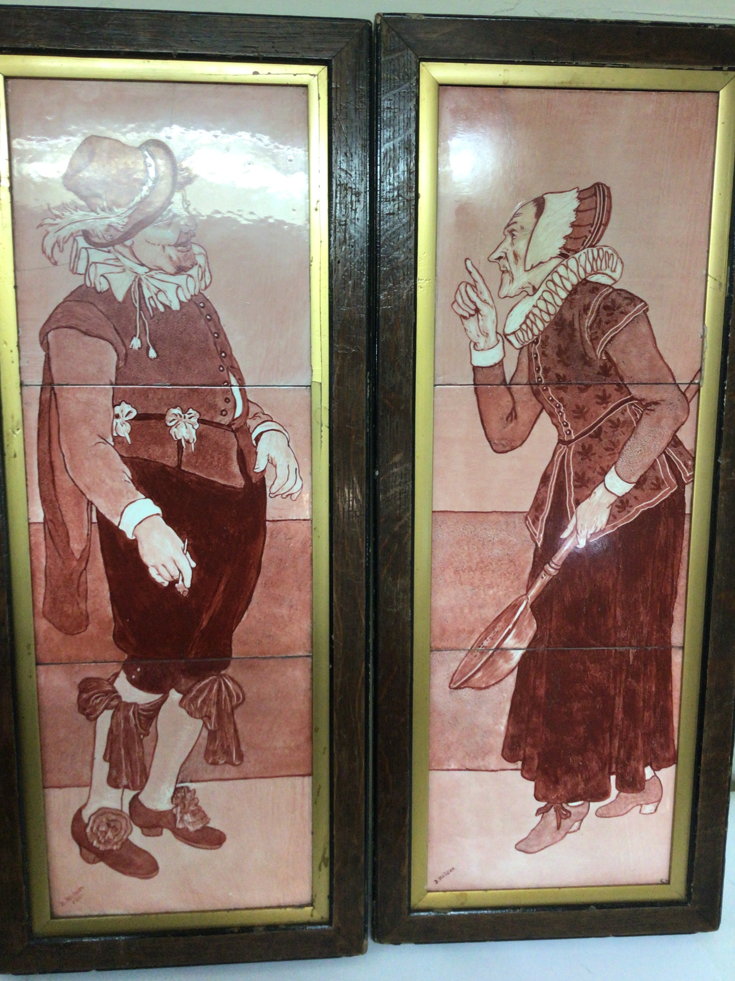  A pair of painted continental 19th century red tile pictures depicting figures in traditional dress in oak frames signed D Watson 1881 no obvious damage 70x30cm 
