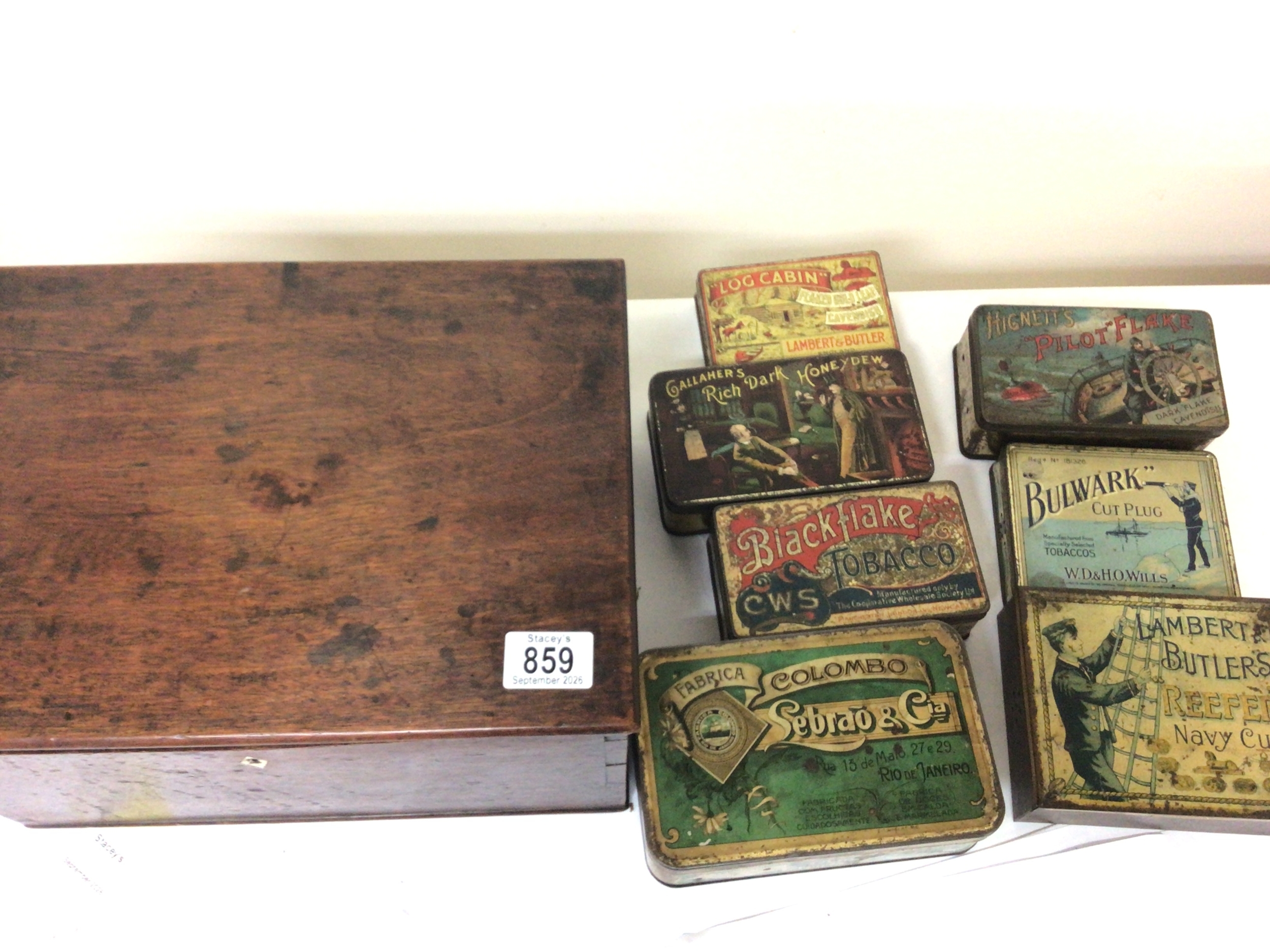  A George III mahogany box of rectangular shape and seven Vintage tins mainly Tobacco. 