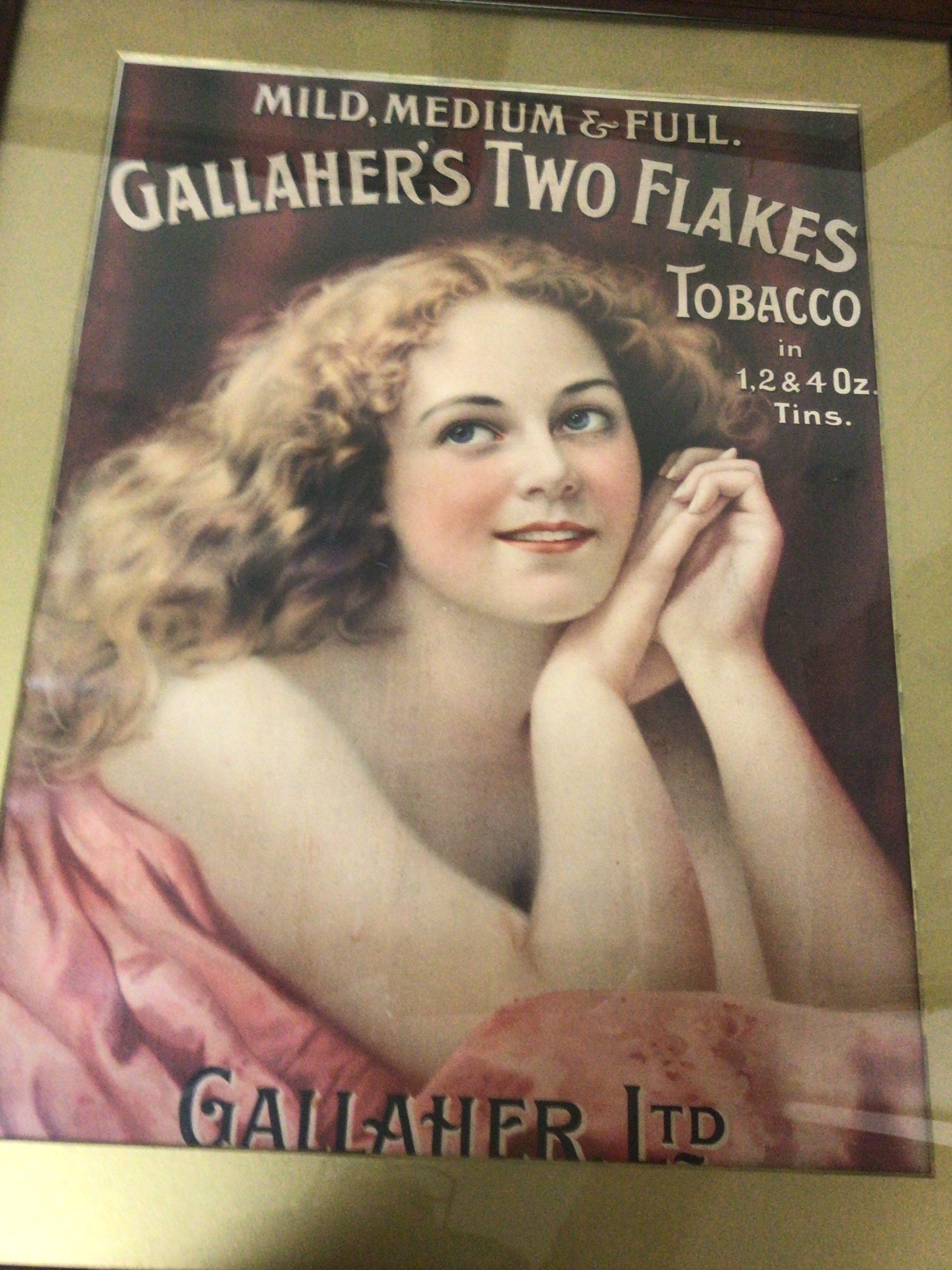  A Vintage Gallaher's Two flake Tobbaco advertisement in an oak frame.