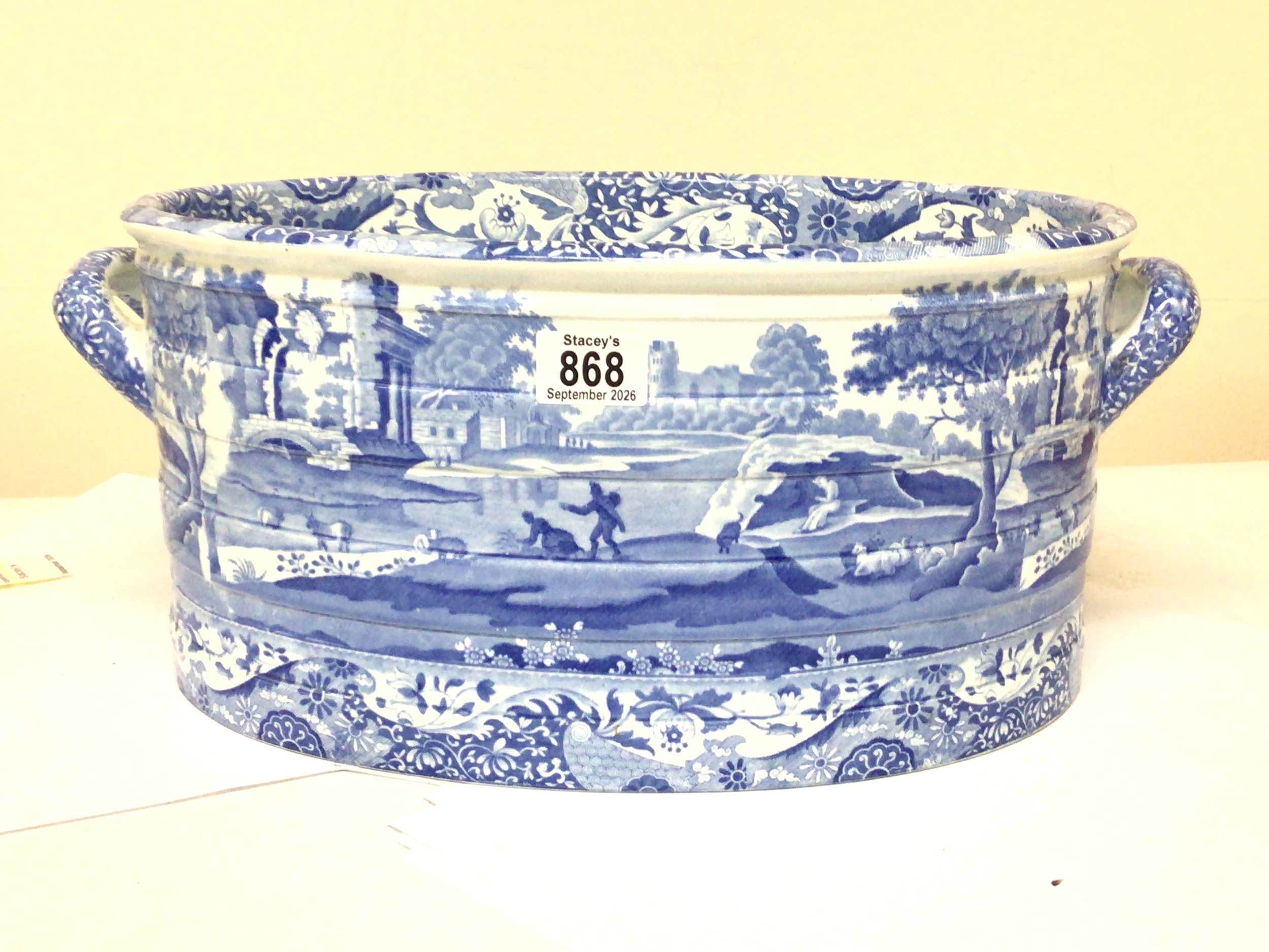  A late 19th or early 20th century Spode blue and white Champagne cooler the sides with landscape views hairline crack. 50cm wide 