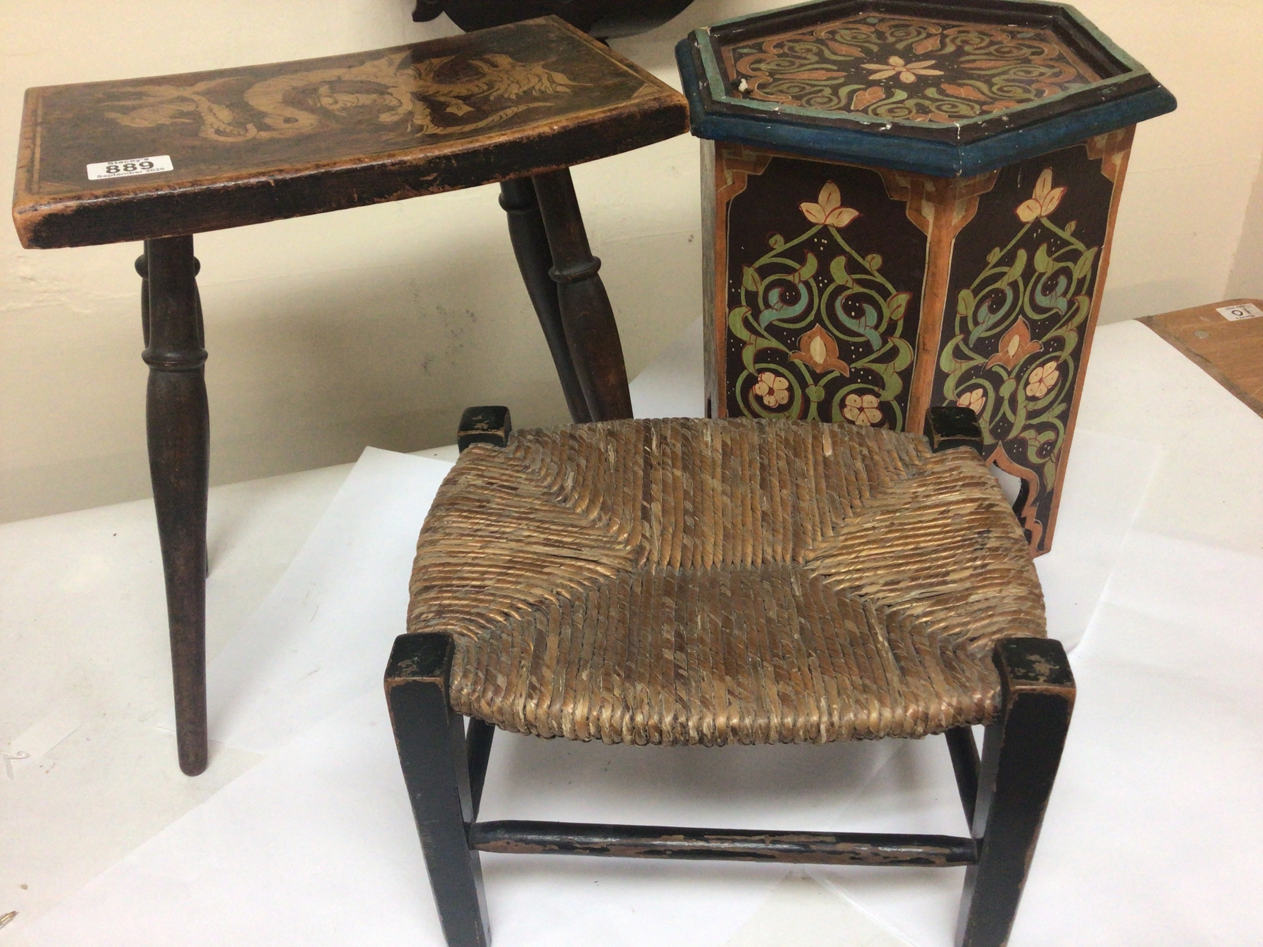  An interesting Vernacular beechwood stool with dragon motif a painted occasional table and a small stool with a rush seat (3) 