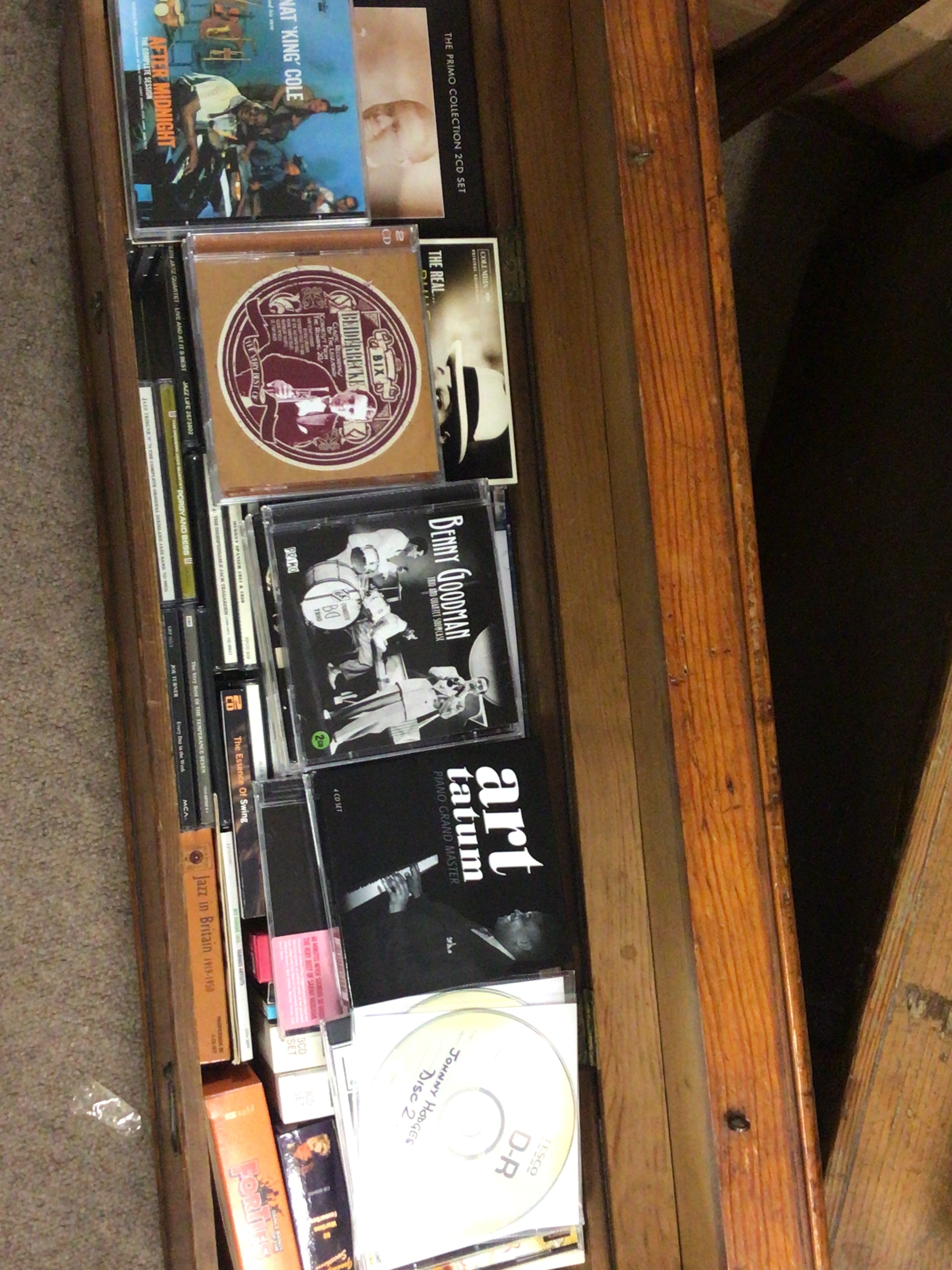  An Antique pine box of rectangular shape containing a quantity of CDs. Mainly Jazz.