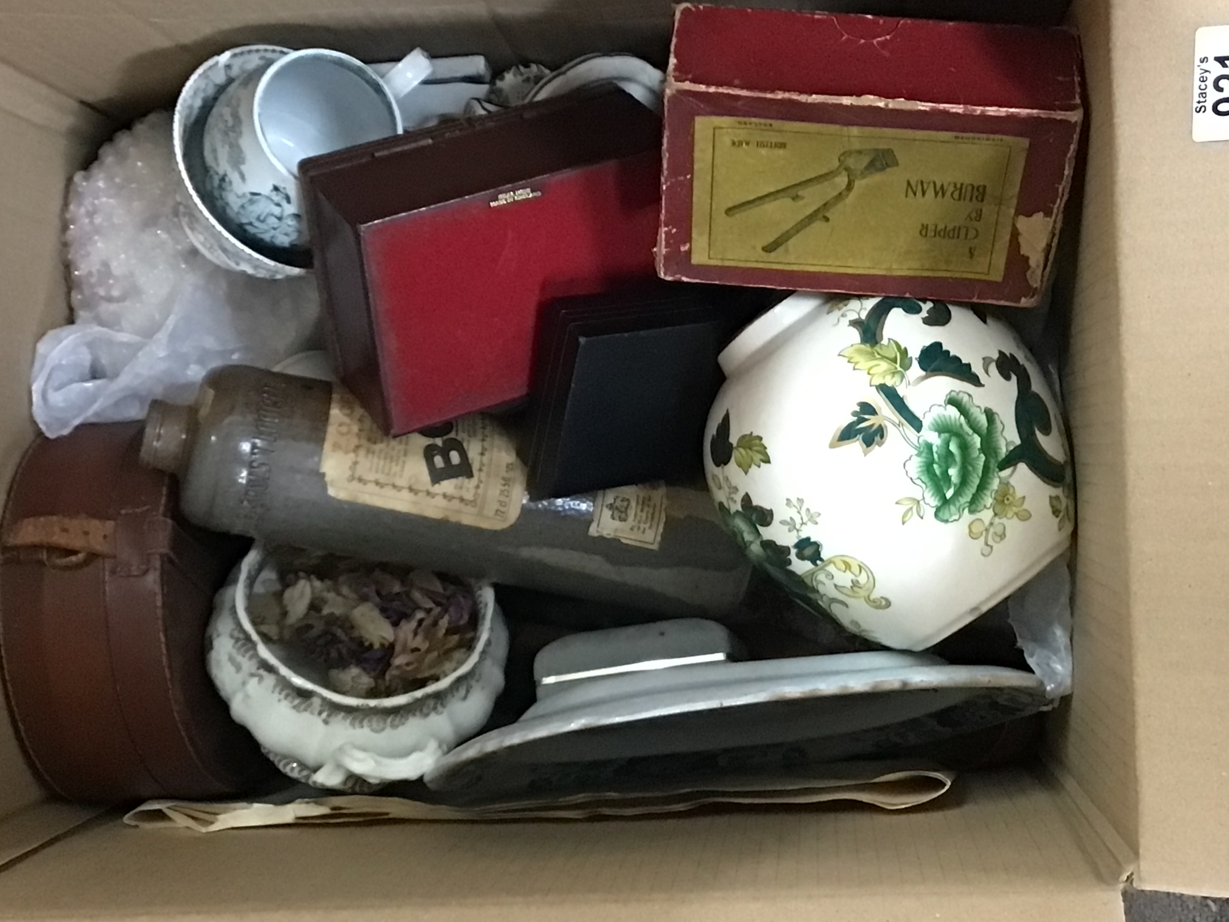 A box containing decorative ceramics and other oddments 