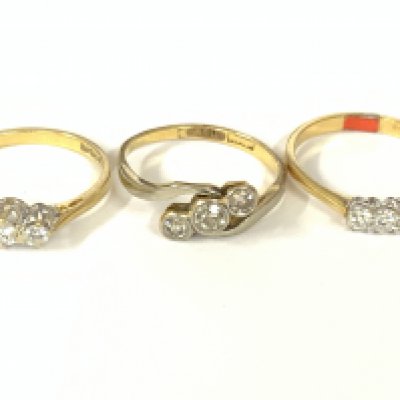 Three 18ct gold three stone diamond rings. Approx ring size J,L. Approx 5.5g. Postage category A