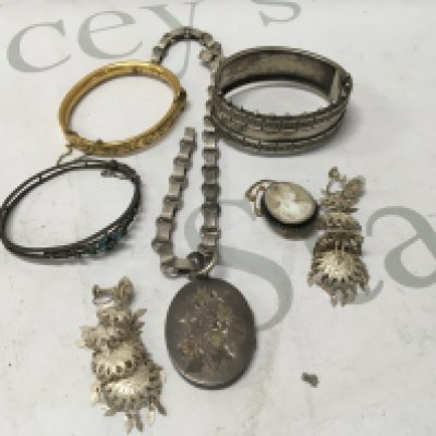 A collection of Edwardian and later jewellery including bangles and necklaces.