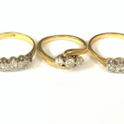 Three 18ct gold three stone diamond rings. Approx ring size G,J,L. Approx 8.2g. Postage category A