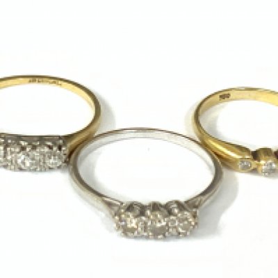 Three 18ct three stone diamond rings. Approx ring size H,M,O. Approx 6.2g. Postage category A