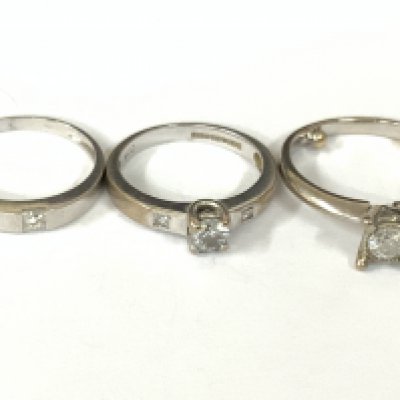 Three 18ct white gold diamond solitaire. Approx ring size I,J. Approx 8gm. Postage category A