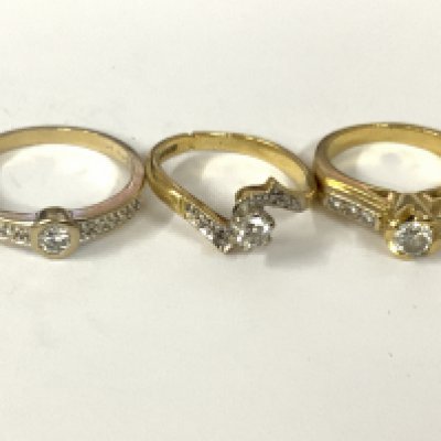 Three 18ct gold diamond solitaires with diamond shoulders. Approx ring size I,L,O. Approx 11.9g. Postage category A