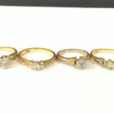 Four 18ct gold diamond solitaire ring with diamond shoulders. Approx ring size H,G,K,N. Approx 12.5g. Postage category A