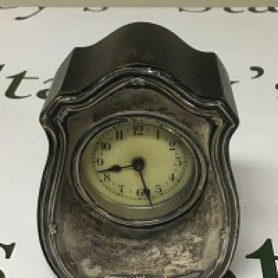 A silver mounted 1913 alarm clock not seen working Birmingham hallmarks. Height 12cm.