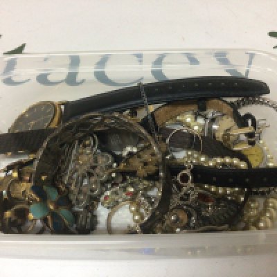 A collection of costume jewellery including a silver bangle.