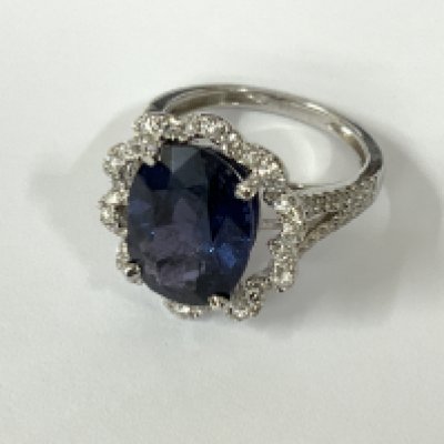 Certificated 18ct white gold lvl blue spinel dress ring with diamond surround and split shoulders. Spinel 5.53ct. RBC diamonds 0.62ct / G-H / VS. Cert no. WGI9634155709. Postage category A.