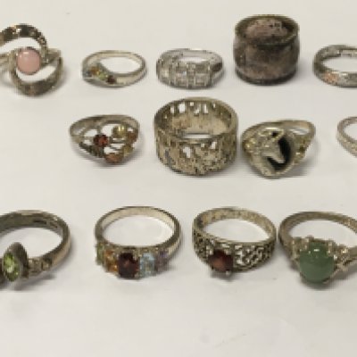 A collection of 19 silver dress rings