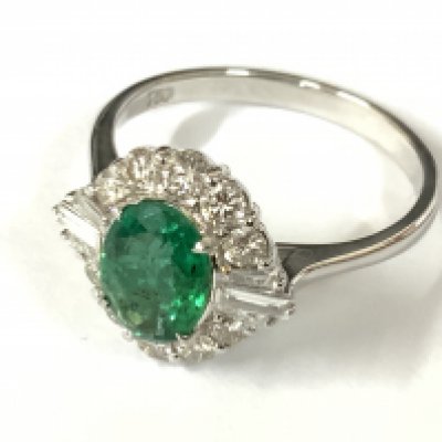 18ct white gold oval emerald and diamond cluster ring. Emerald 1.00ct. RBC and tapered baguette diamonds 0.60ct (RBC 0.48ct, tap bags 0.12ct) approx ring size O. Postage category A