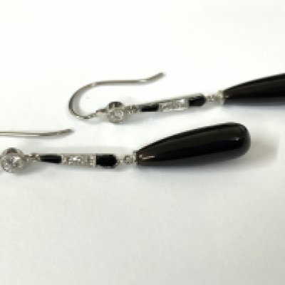 Pair drop earrings set with onyx and diamonds with fish hook backs. Postage category A