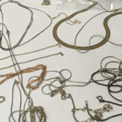 A collection of necklaces and bracelets including silver.