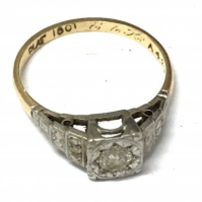 An 18ct gold and platinum ring, approximately 0.25ct. Size N/O. 2.7g total weight Postage category A