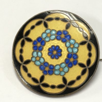 An unmarked enamel brooch , postage category A NO RESERVE