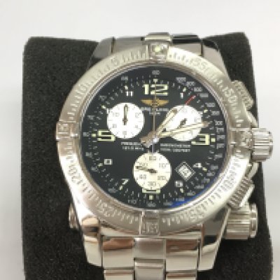 A gents Breitling emergency mission watch with box (missing original inner box) and paperwork. Has service paperwork. 45mm case. Seen running. Chronograph function requires attention. Postage B