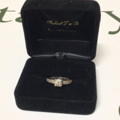 An 18carat white gold ladies ring set with a central brilliant cut diamond. Approximately 0.44 of a carat I J colour and VS Clarity as stated on purchase receipt. Cost price $2700 US dollars The central stone the central brilliant cut diamond flanked by ten further diamonds set in the ring. Ring size K weight 4.4g